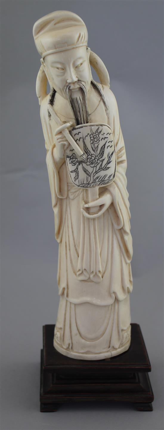 A large Chinese ivory figure of a scholar, early 20th century, 26.5cm, wood stand